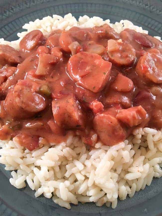 finished red beans and rice with sausage meal on blue plate