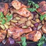 oven roasted chicken and potatoes on baking pan