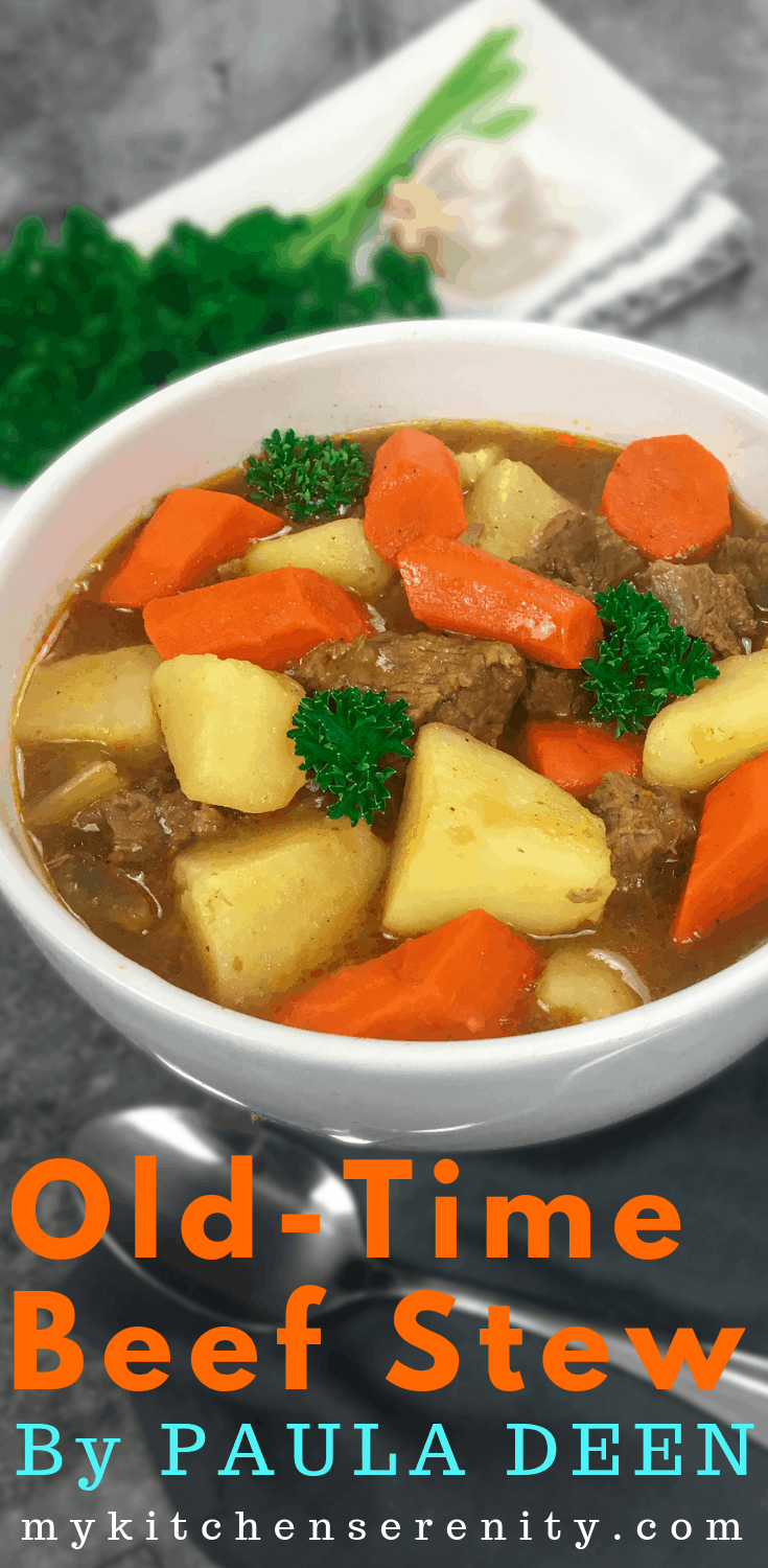 vegetable beef stew in white bowl with spoon