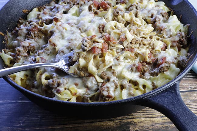 creamy beef pasta bake in cast iron skillet