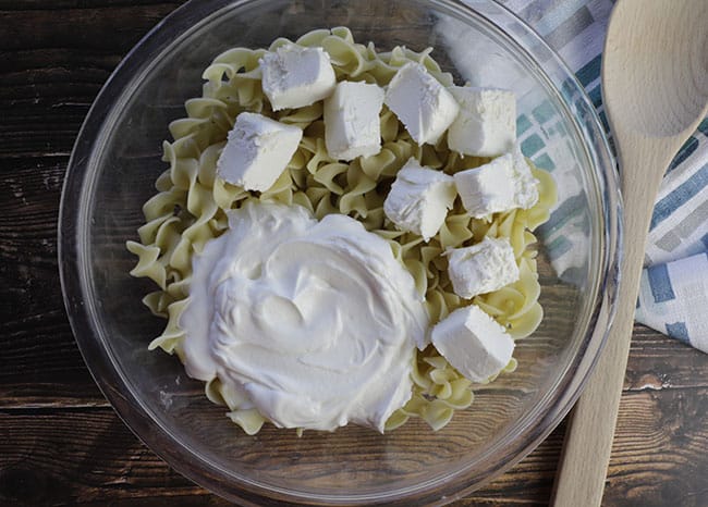 cooked egg noodles with cream cheese and sour cream