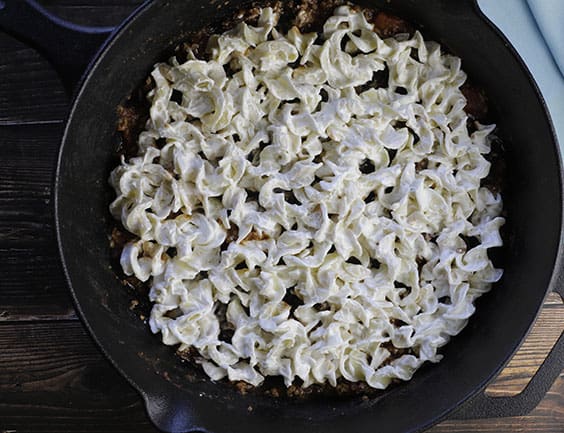 cheesy noodle layer in bottom of skillet