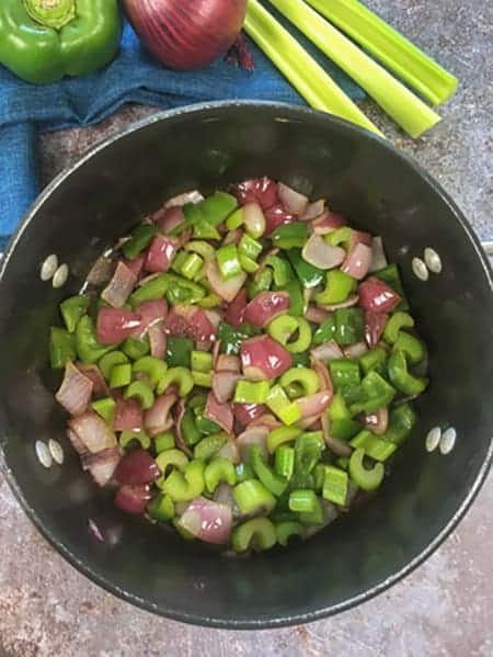sauteed onions and bell peppers in black pot