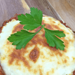 lasagna stuffed portobellos on wooden board