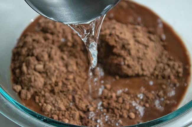 chocolate cake batter in glass mixing bowl