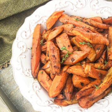 roasted carrots in white serving bowl