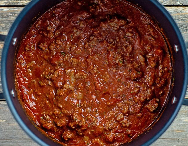 cooked red meat sauce for lasagna in pot