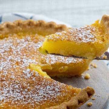 baked pie with lemon peel decoration on top