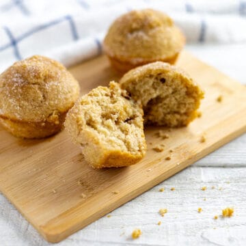 baked muffins on wooden cutting board