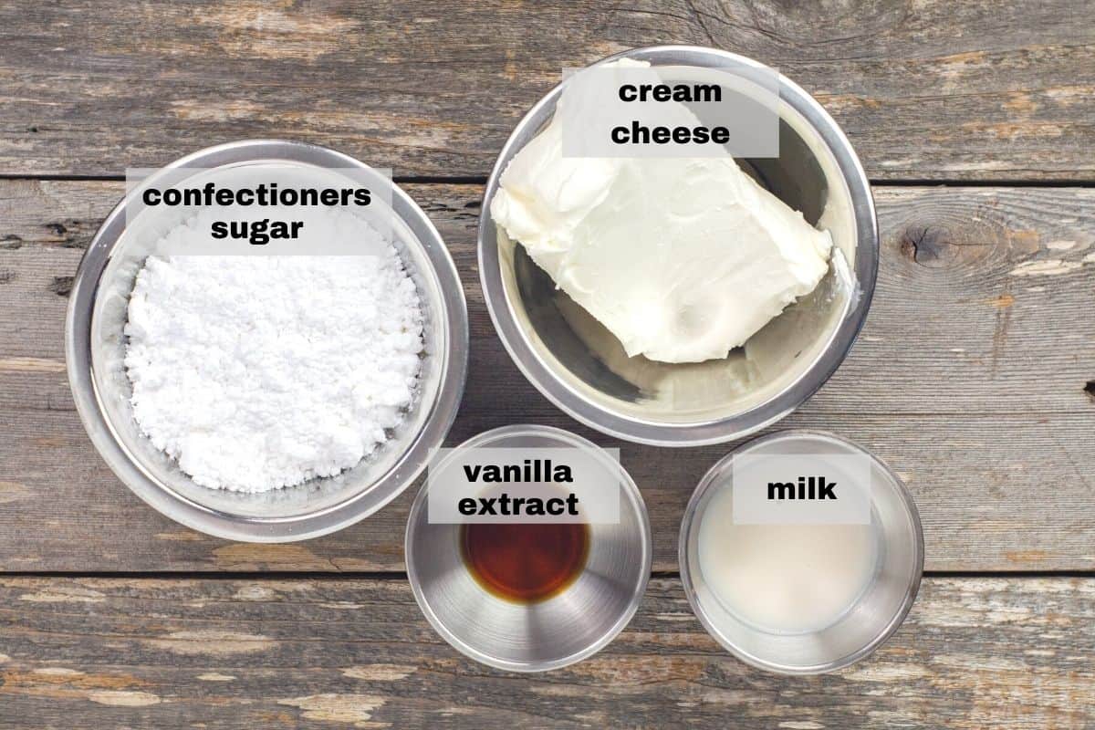 icing ingredients measured out in bowls on countertop
