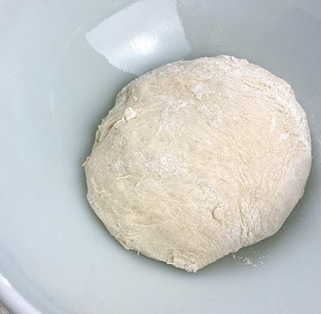 dough in bowl before rising