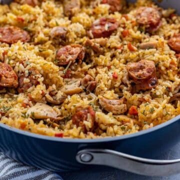 Cooked Chicken and Sausage Jambalaya in pan with toasted french bread on the side