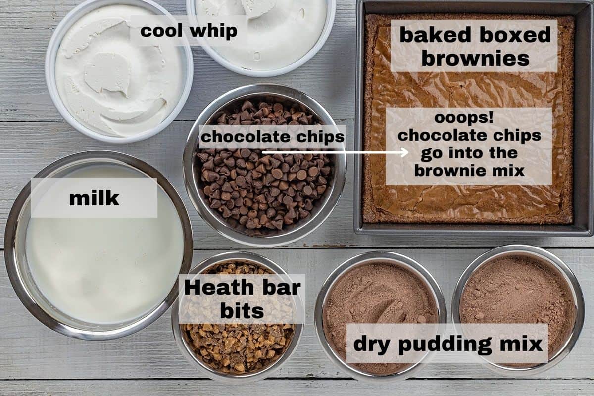 ingredients measured out in individual bowls on counter top.  square pan of baked brownies.
