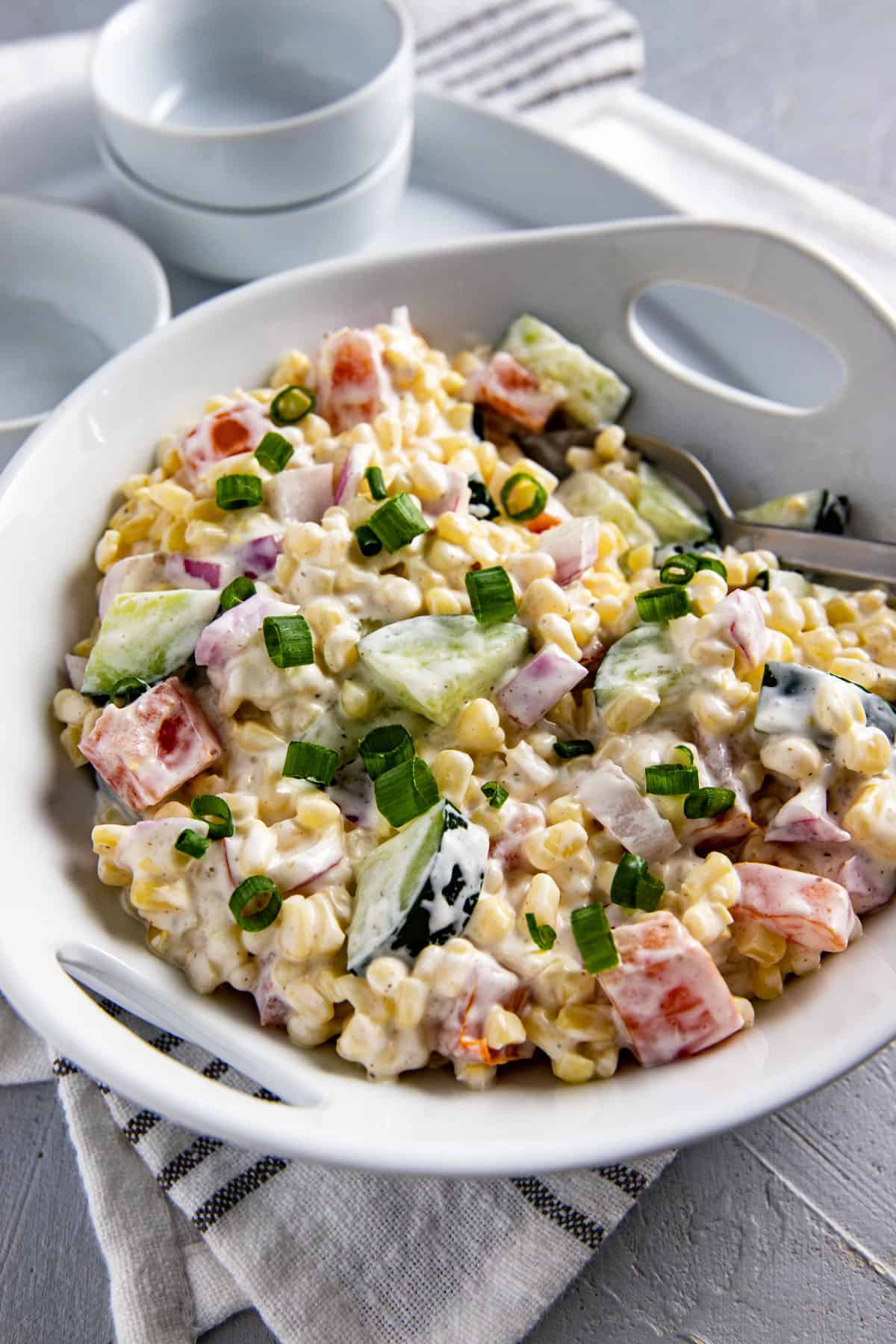 corn salad in white serving dish