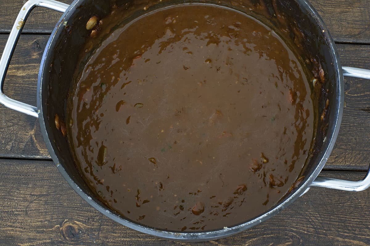 cooked roux in black pot.