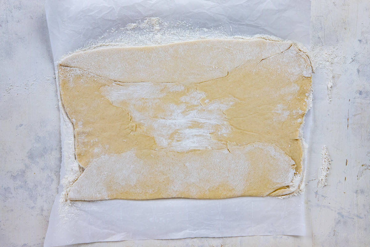 Dough rolled out into a rectangular shape.