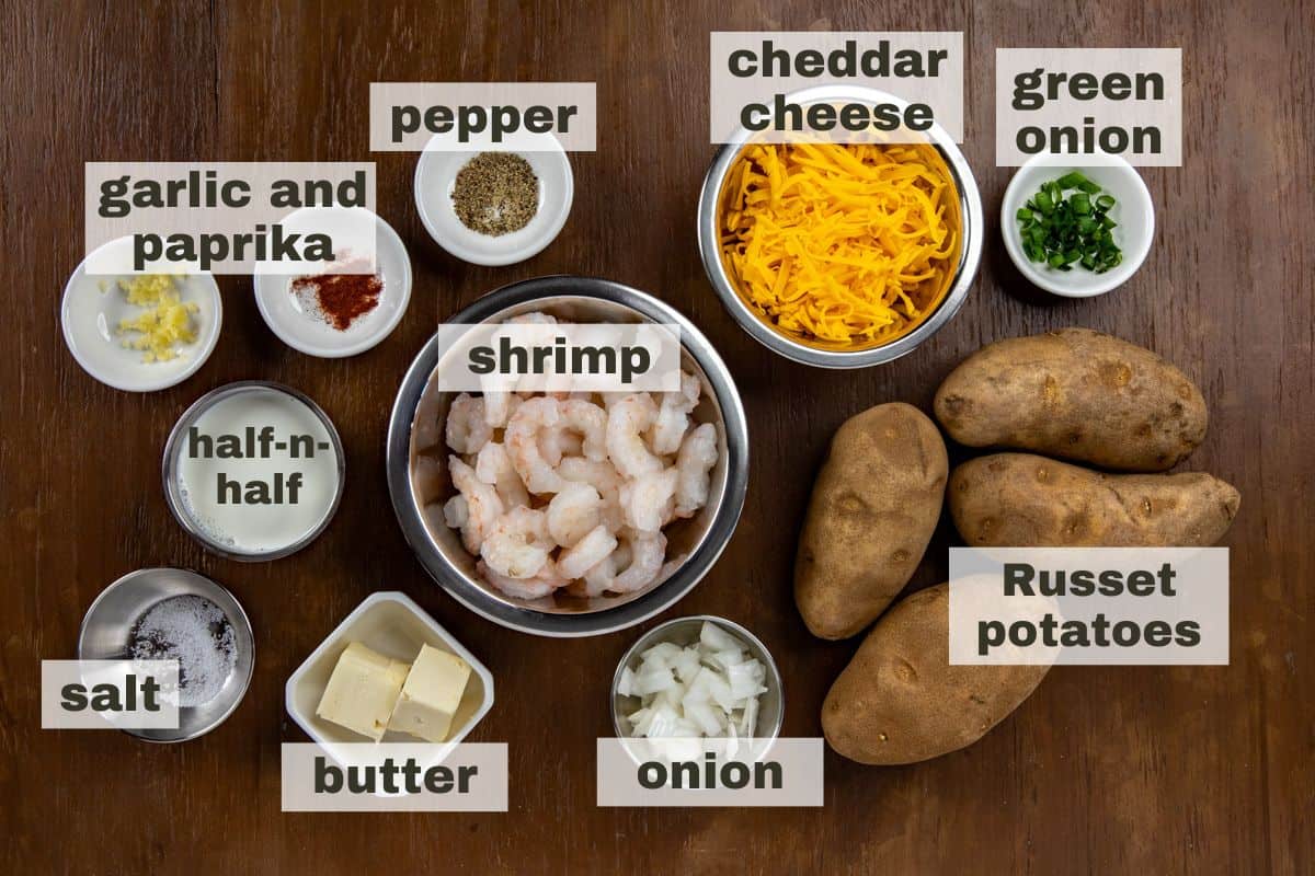 Ingredients measured out in individual containers on wooden countertop.