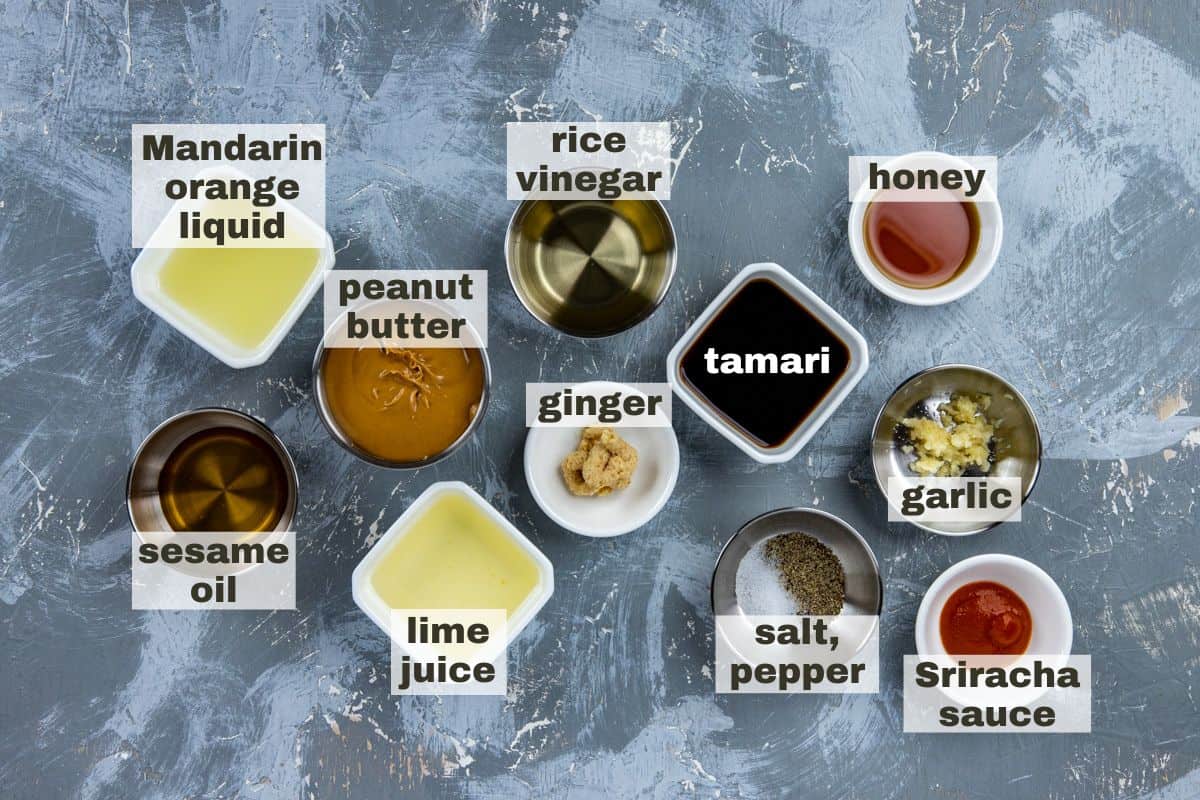 Dressing ingredients measured out in individual bowls.