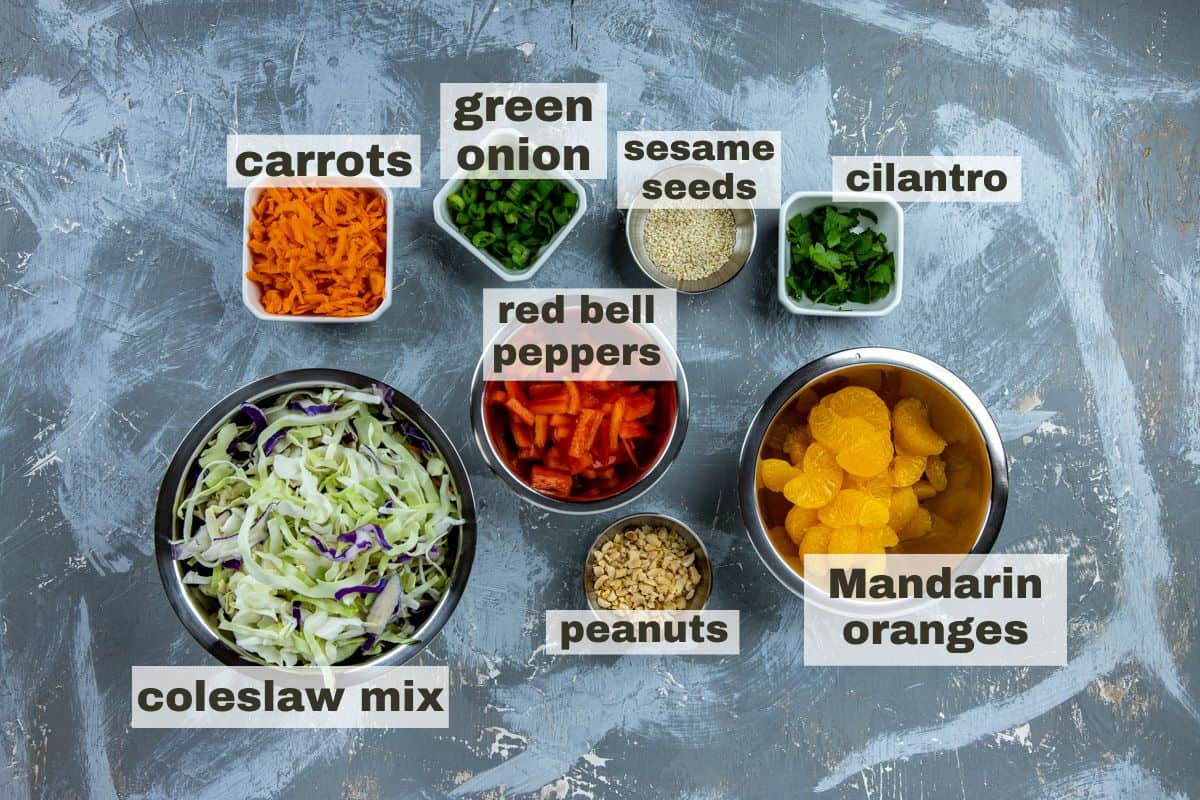 Salad ingredients measured out in individual bowls.