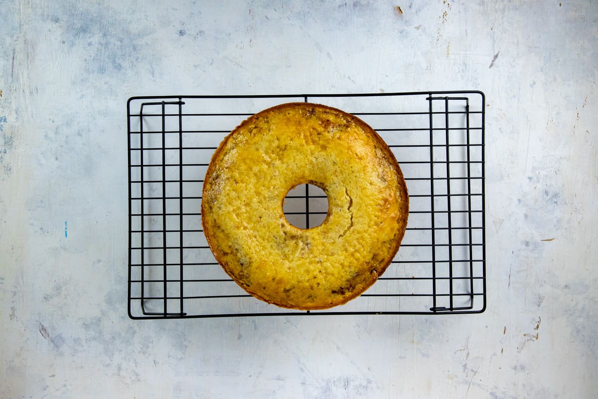 Baked cake cooling on a wire rack.