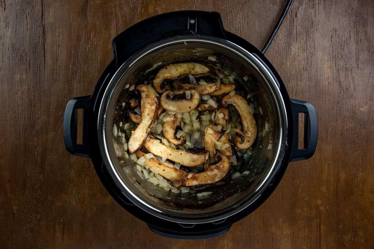 Sauteed onions and sliced mushrooms in the Instant Pot.
