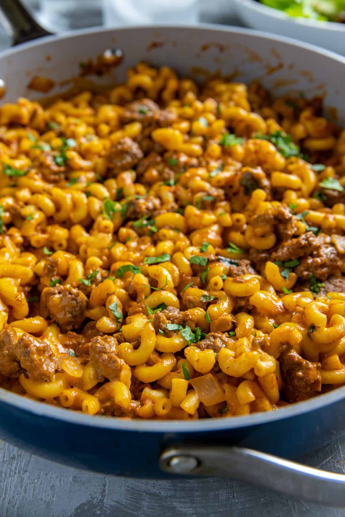 Cooked hamburger mac and cheese in skillet.