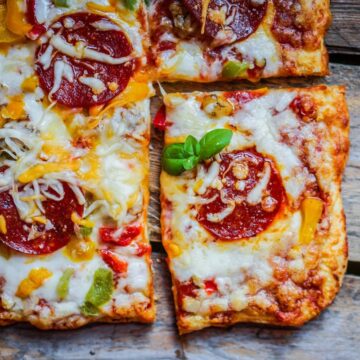 Baked pizza with slice removed.