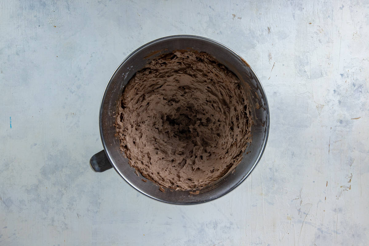 Frosting blended in stainless steel mixing bowl.