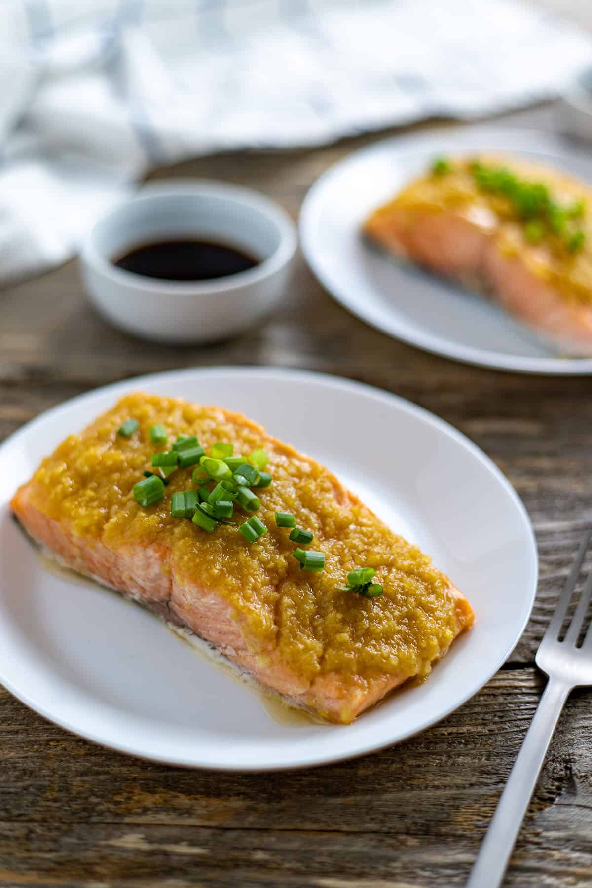 One salmon fillet topped with miso ginger apple topping.