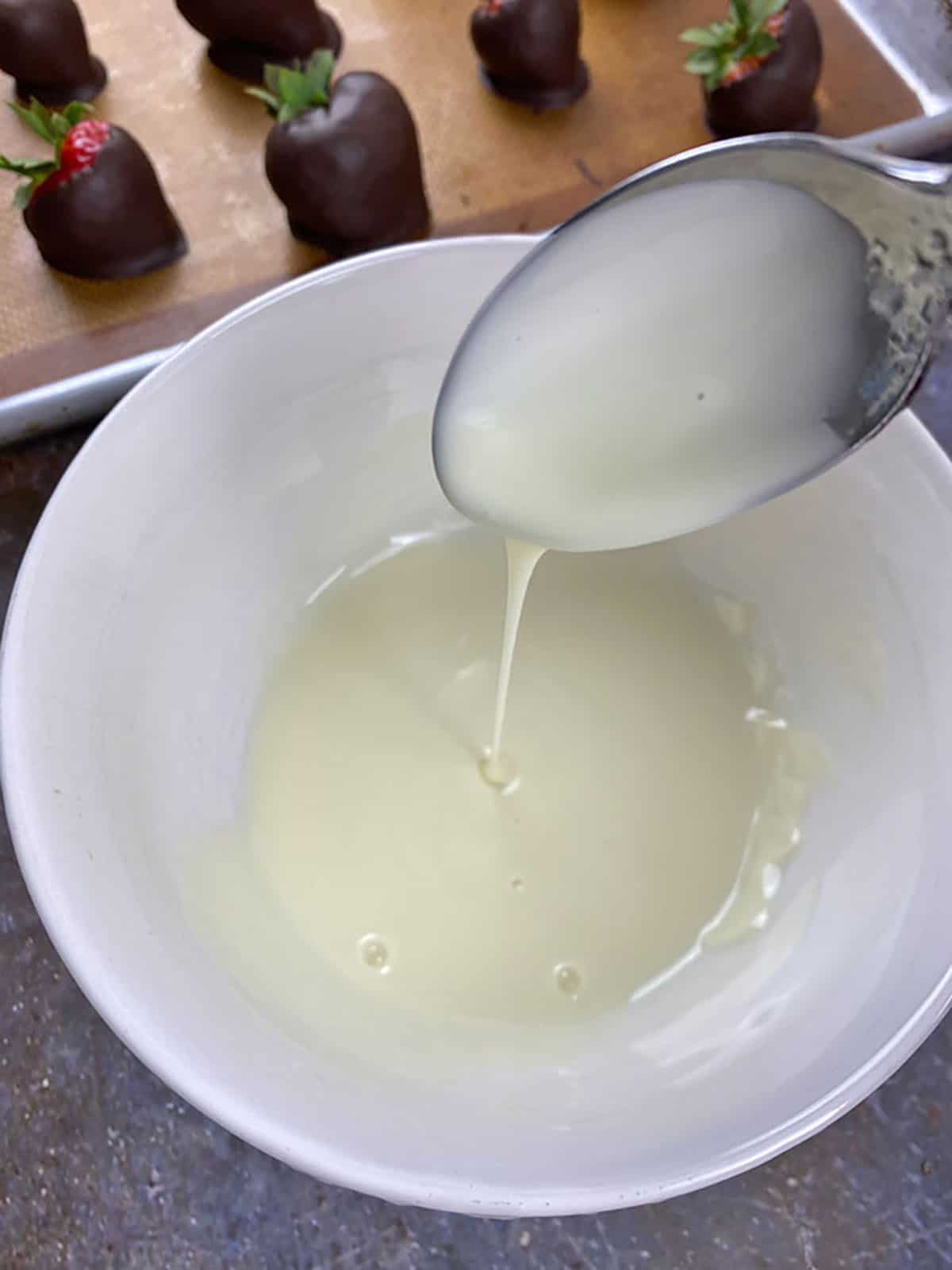 White chocolate chips melted in a bowl.
