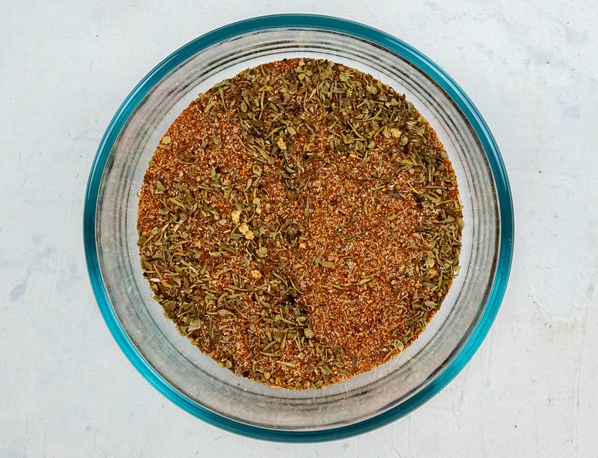 Homemade seasoning in a small glass bowl.