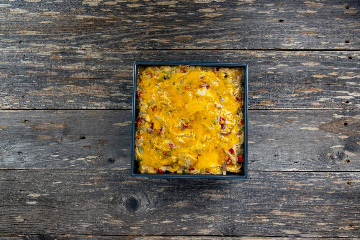 Baked King Ranch Chicken Casserole in square metal baking dish.