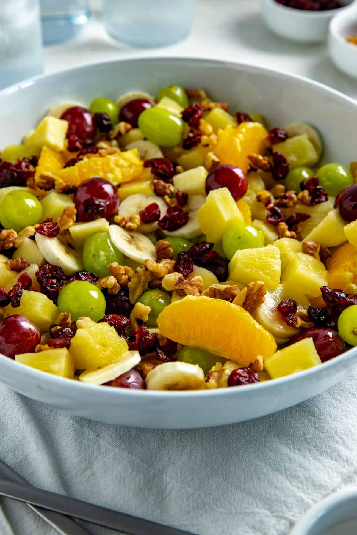 Fruit Salad in a white serving bowl.