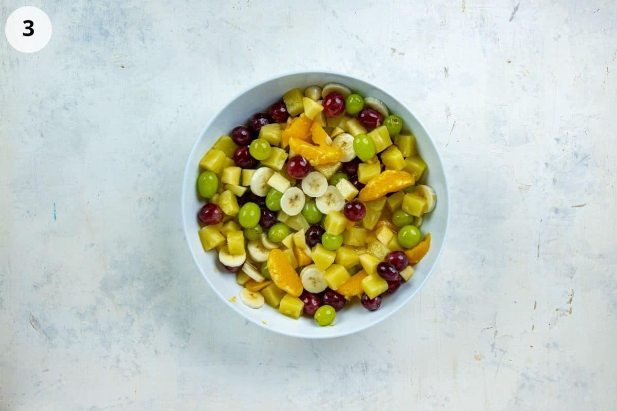 Sliced banana added to the fruit salad.