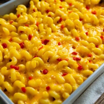 Creamy Pimento Cheese Macaroni and Cheese garnished with chopped pimentos on top.