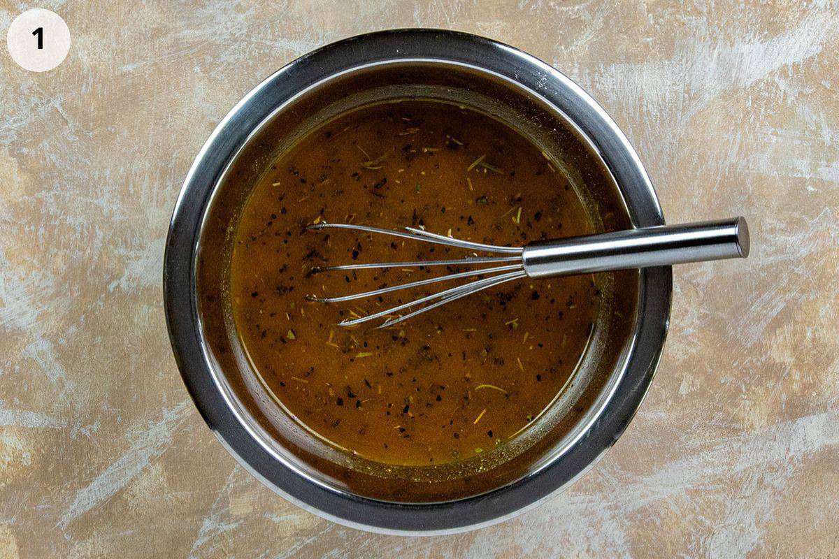 Oil and seasonings mixed up in a bowl.