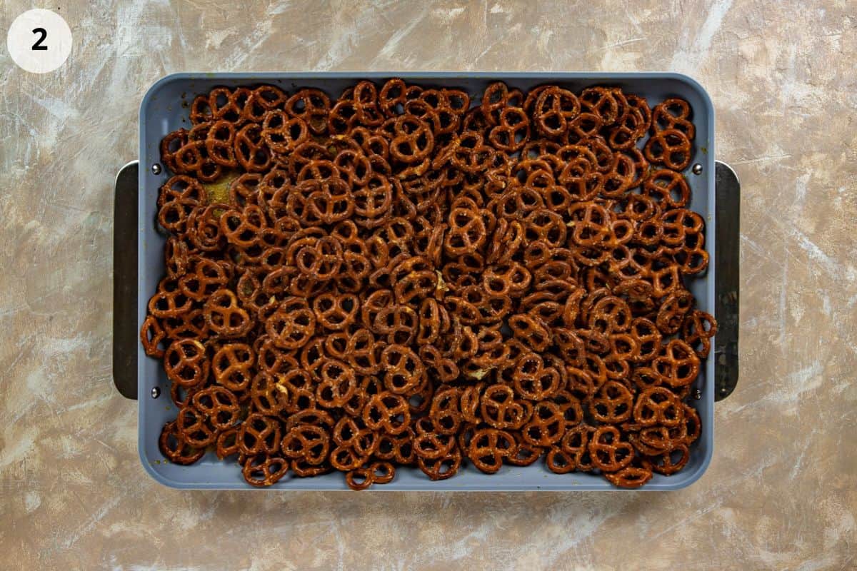 Seasoned pretzels on a sheet pan.