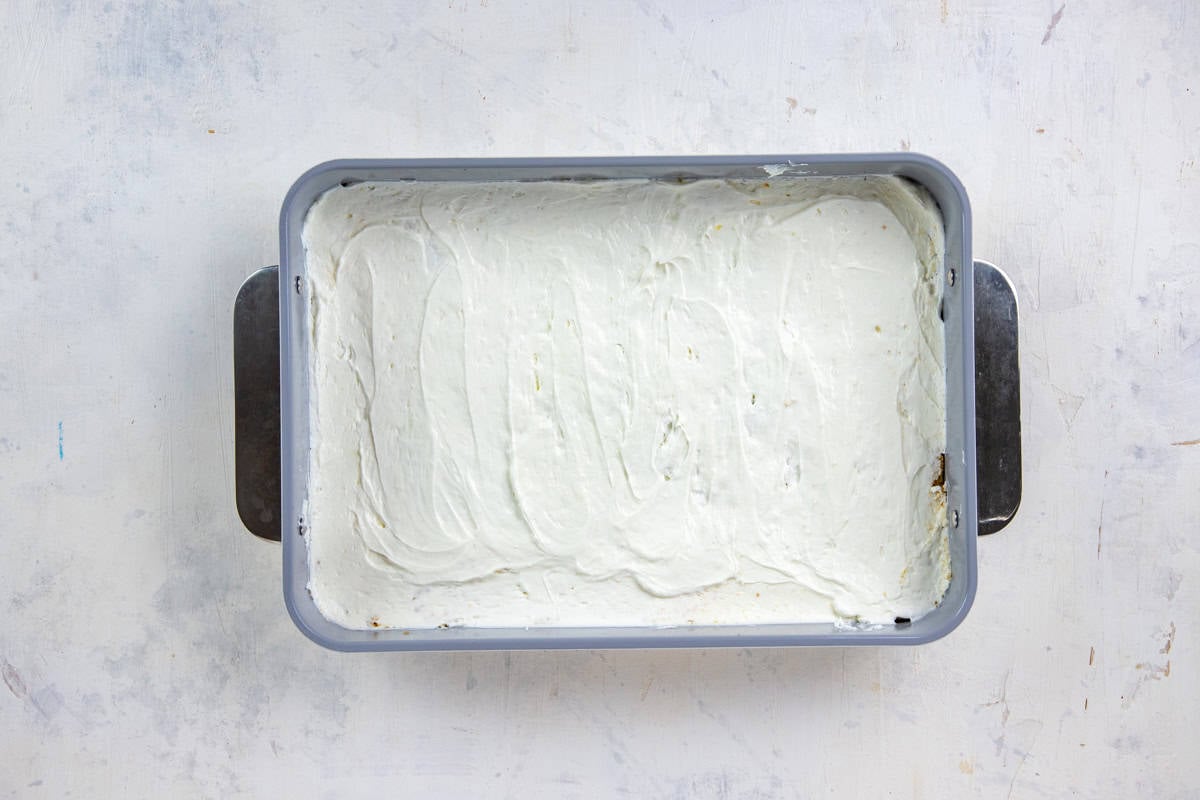 Cream cheese mixture spread on top of the cookie crust a 9x13-inch baking pan.