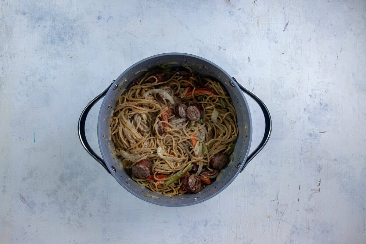 Cooked sausage spaghetti with cream cheese stirred in.