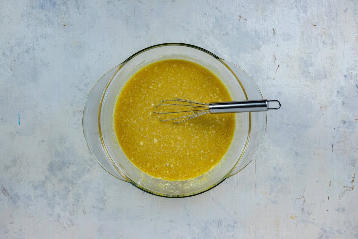 Softened butter, white sugar, brown sugar, eggs, and vanilla extract in a glass mixing bowl.