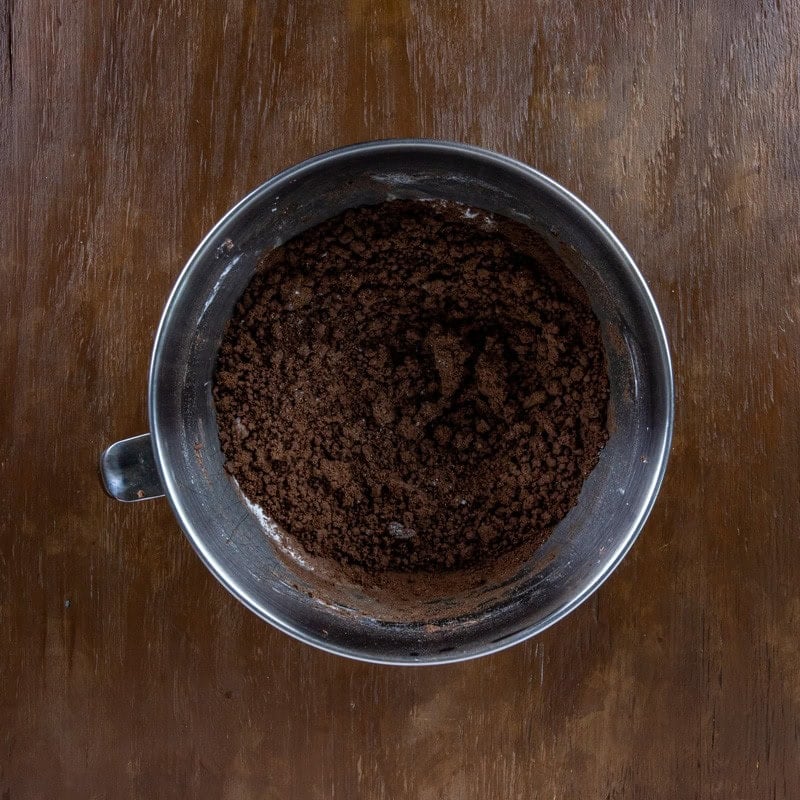 Butter and cocoa powder blended in a mixing bowl.