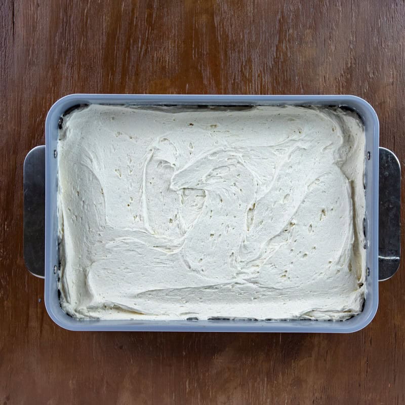 Cake batter in a 9 by 13-inch baking pan.