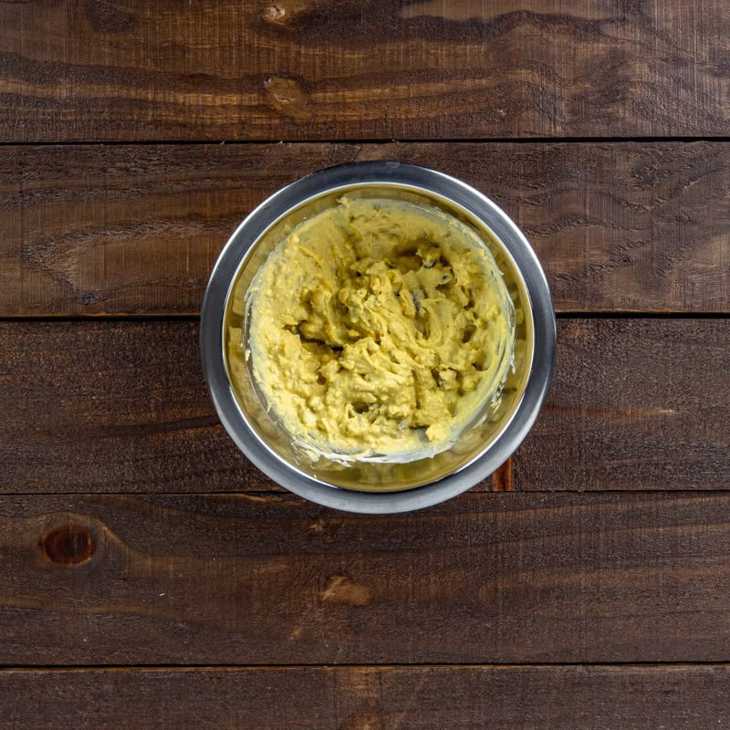 Mixing bowl containing egg yolk mixture.