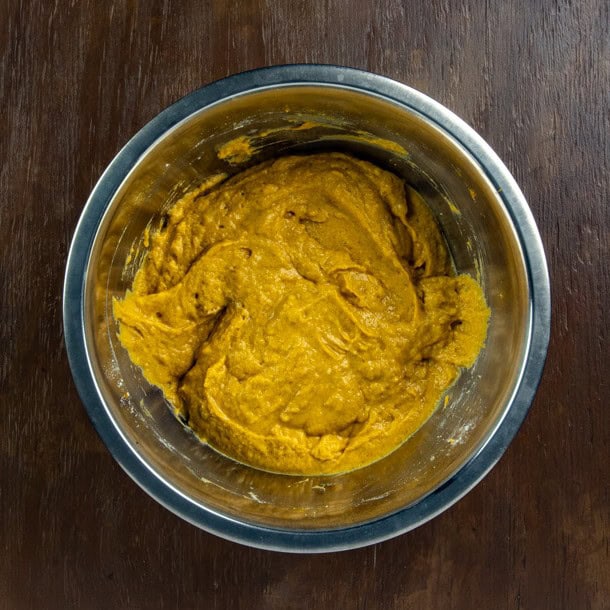 Eggs, pumpkin puree, sugar and buttermilk mixed up in a bowl.