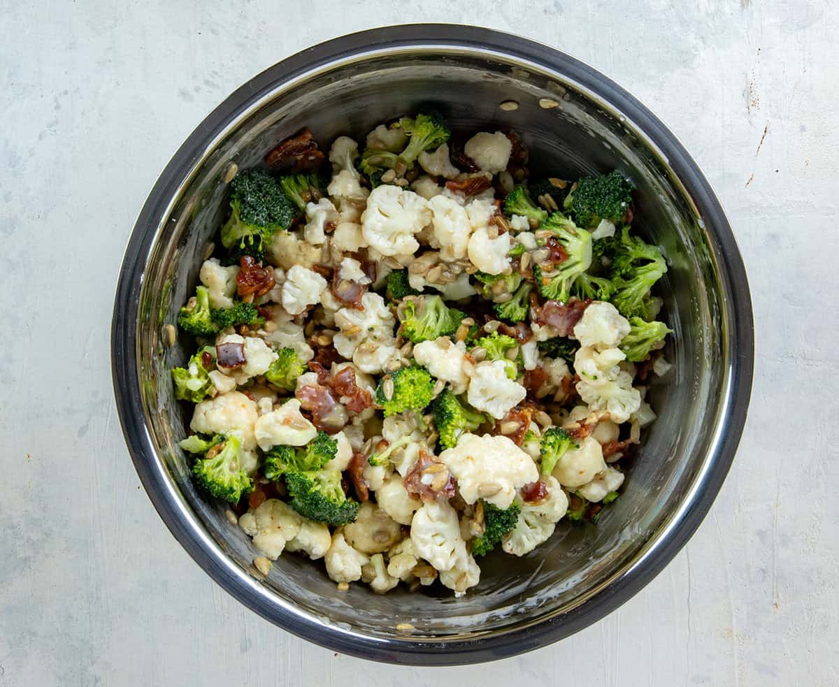Chopped broccoli and cauliflower, chopped bacon, and sunslower seeds added to the creamy mayonnaise mixture.