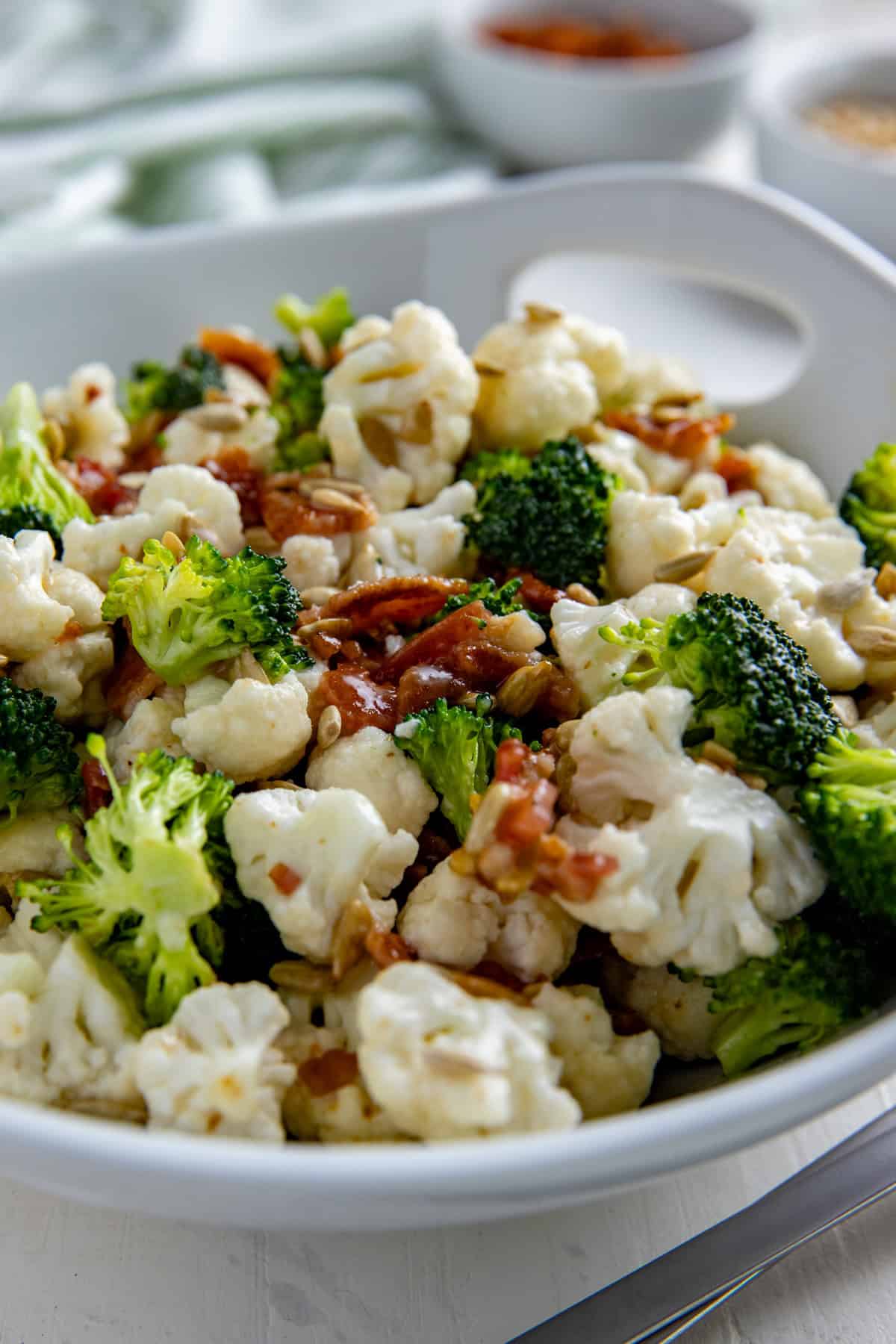 Broccoli and Cauliflower Salad in a white serving bowl.
