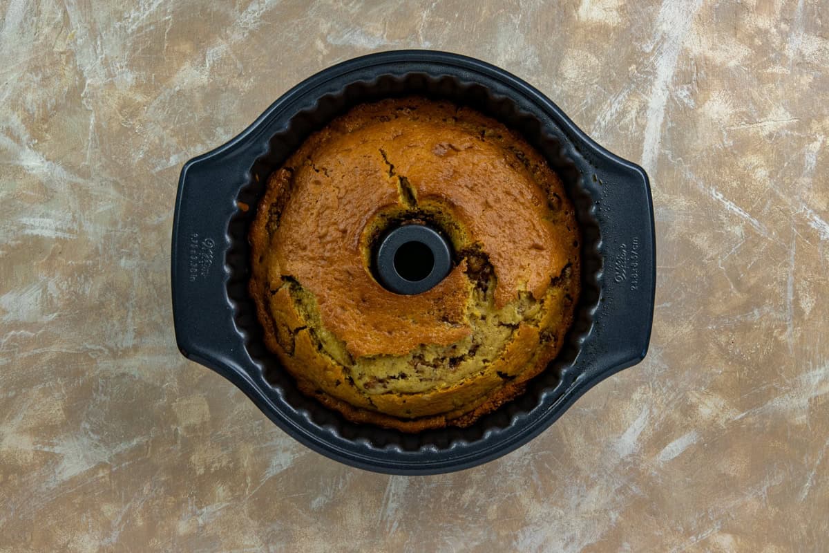 The baked cake still in the pan.