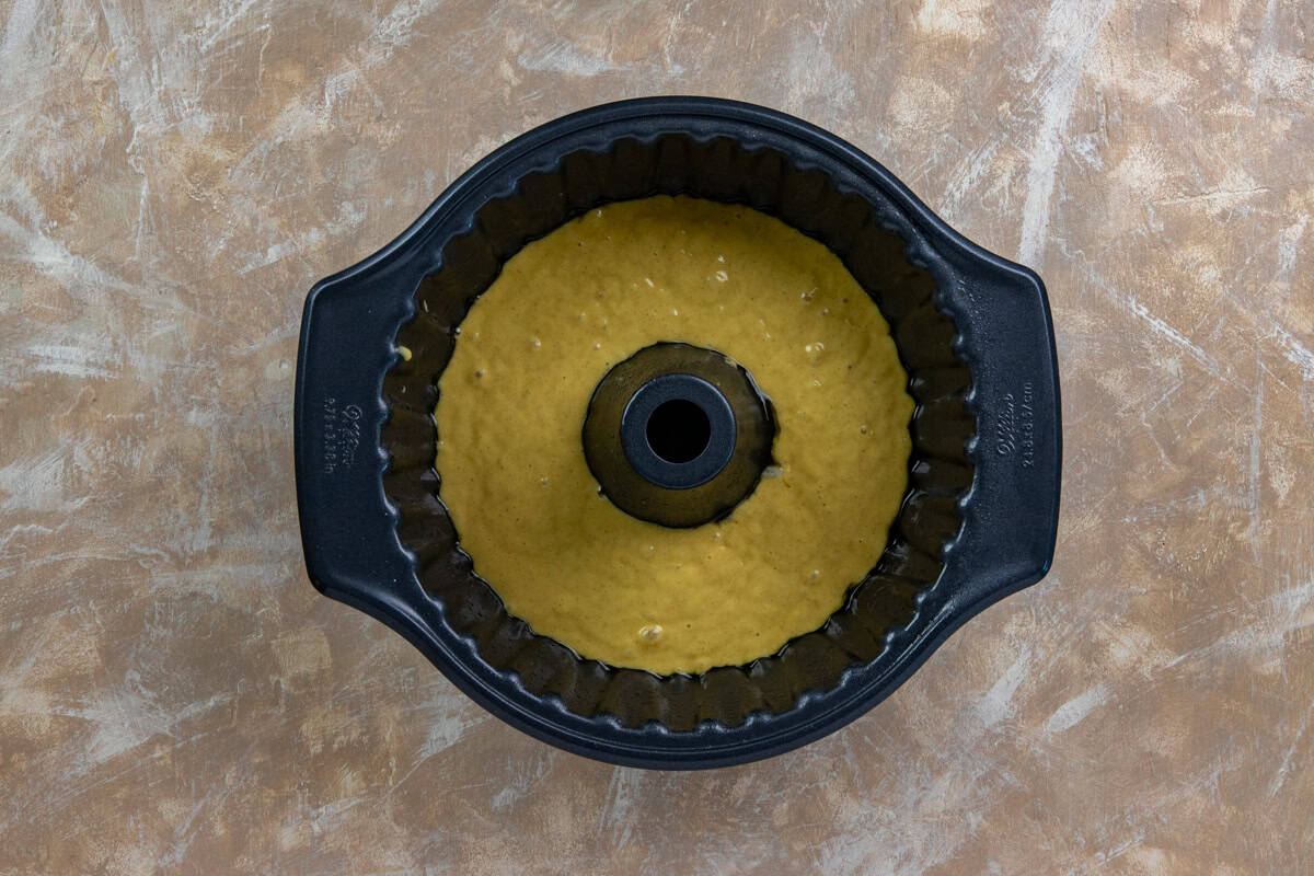 Most of the cake batter in a Bundt pan.