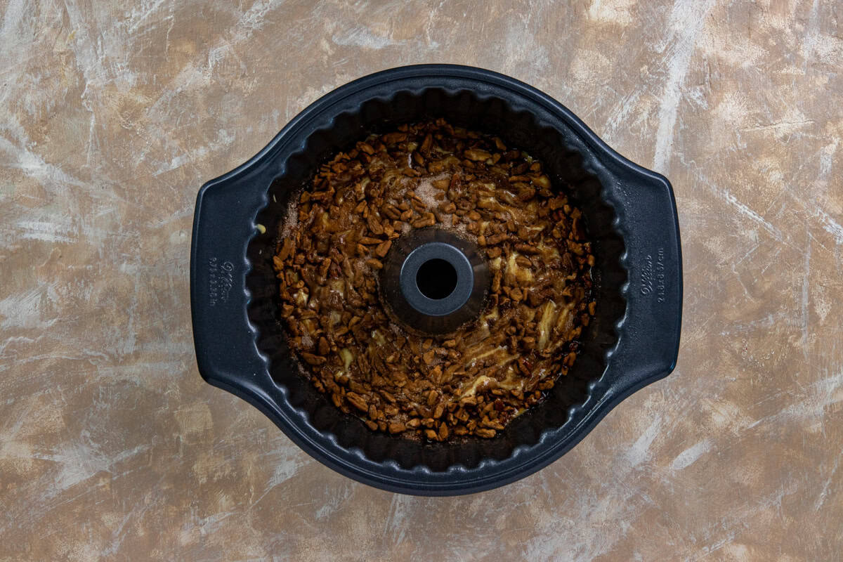 The cinnamon-sugar-pecan mixture sprinkled on top of the cake batter in the Bundt pan.