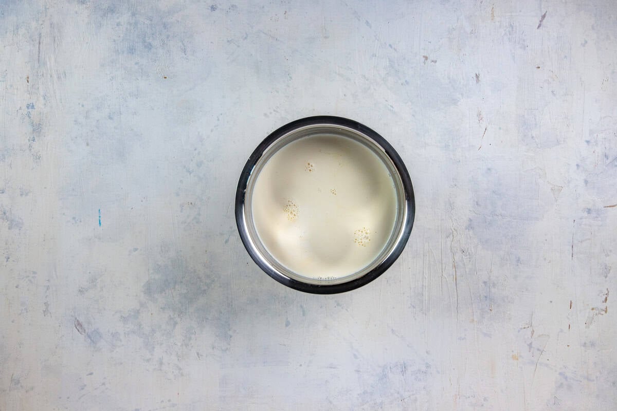 Half and half and evaporated milk in a bowl.